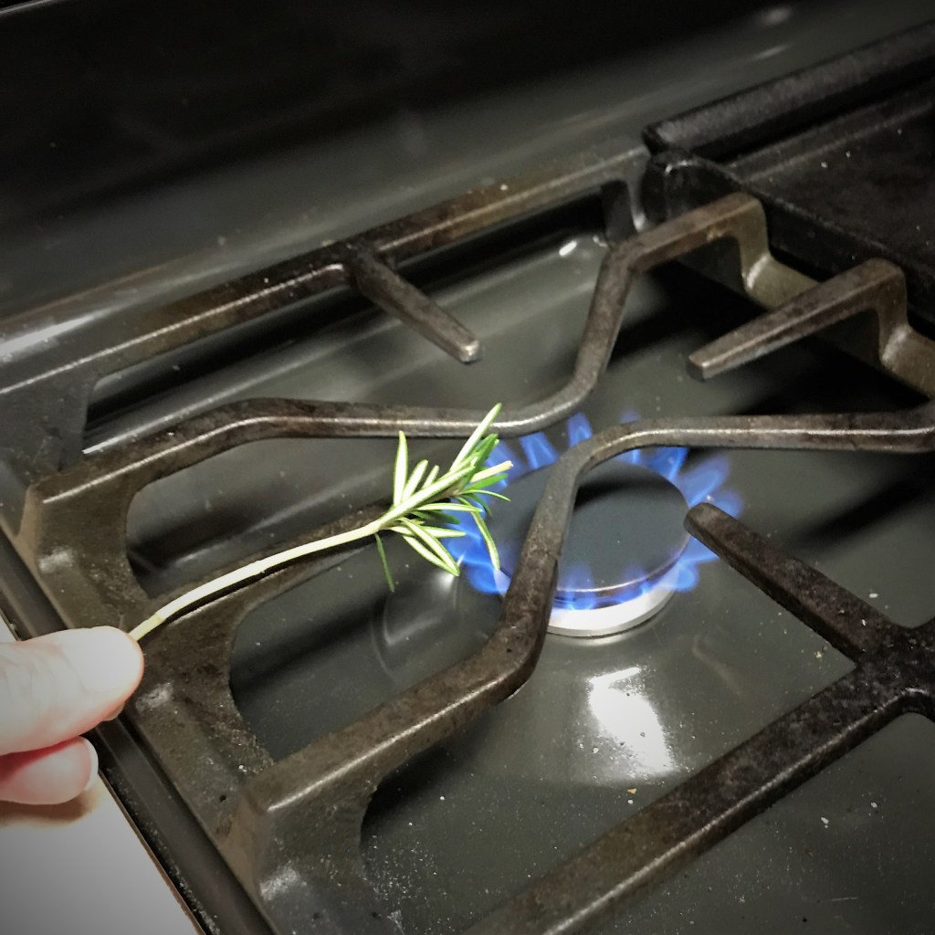 My kitchen torch was out of fuel, so I turned to my trusty gas range to scorch the rosemary.